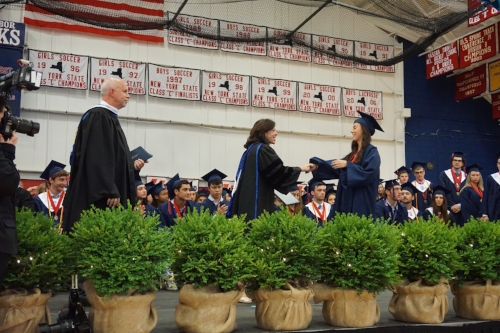  One-by-one, graduates crossed the stage during the Cold Spring Harbor 2017 graduation ceremony to receive their diplomas.    