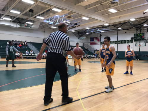  Justin Flood (no. 10) to receive the ball from referee in the Northport unified basketball against William Floyd. 