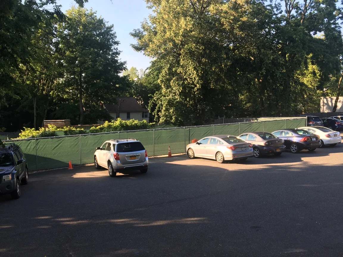 Developer Fences Off Part Of Parking Lot