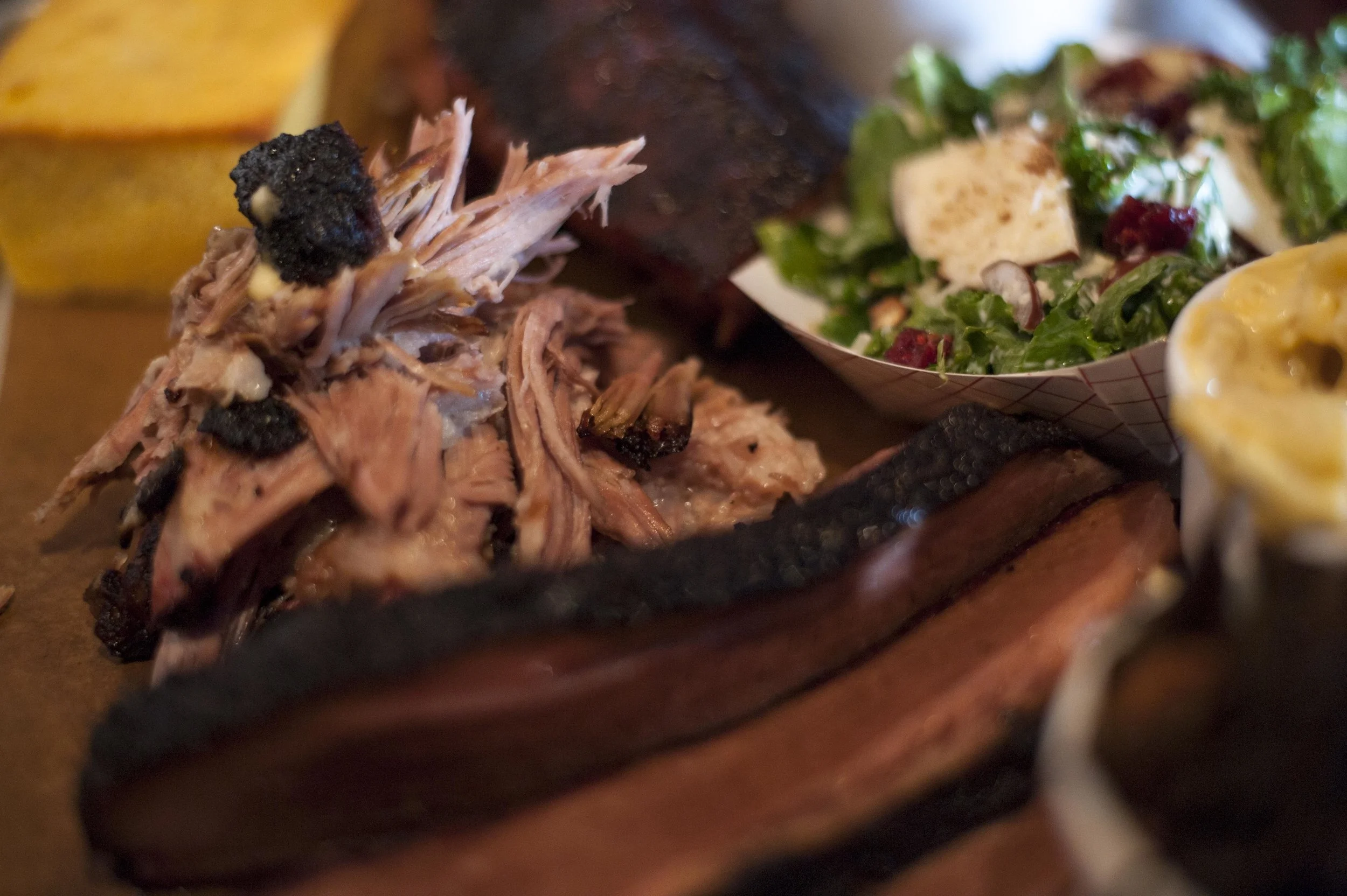  Tender and textured, the Pulled Pork pairs excellently with the bourbon-infused barbecue sauce. 