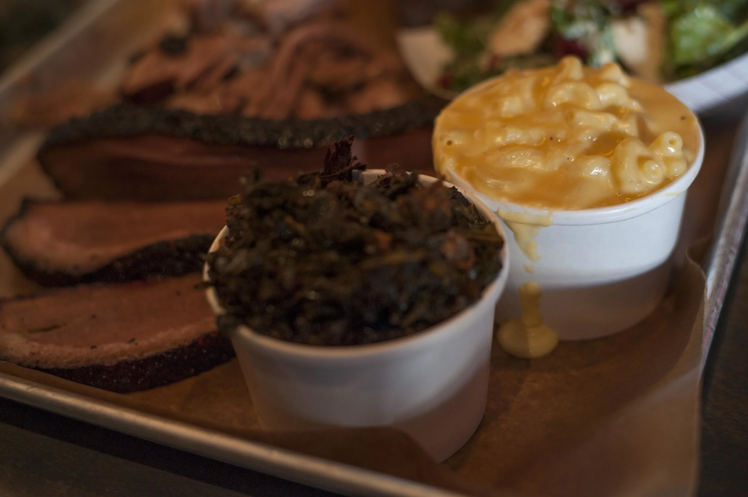 The collard greens are savory, packing a punch like no other. The mac &amp; cheese is creamy, yet subdued. 