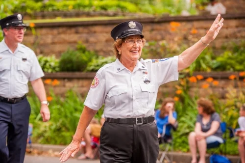  A joyful member of the Eatons Neck Fire Department waves to the crowd at the parade.    