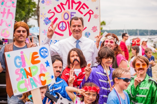  Congressman Thomas Suozzi, flashing a peace sign, also stood with the marchers straight from the 60s. 