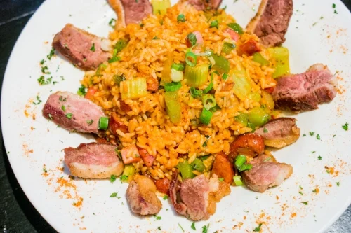 The Fire and Rice Jambalaya is served with either chicken, shrimp, crawfish or duck, and blends rice with Cajun onion, green peppers and celery. 