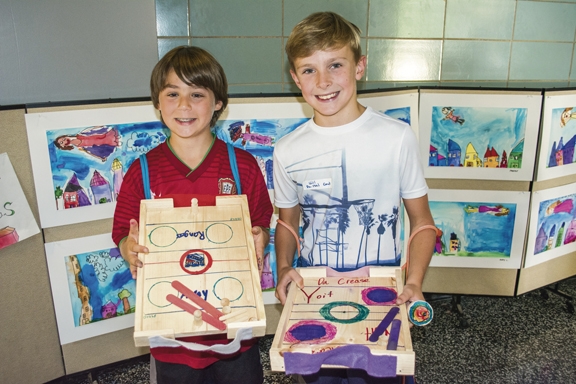  Alex Braunstein and William Eagers, both 11 years old, show off their fully functional hockey rinks made in Advanced Woodcrafting. 