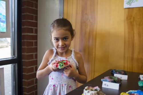  Phoebe Milewski, 7 years old, shows off her sculpted turtle. 