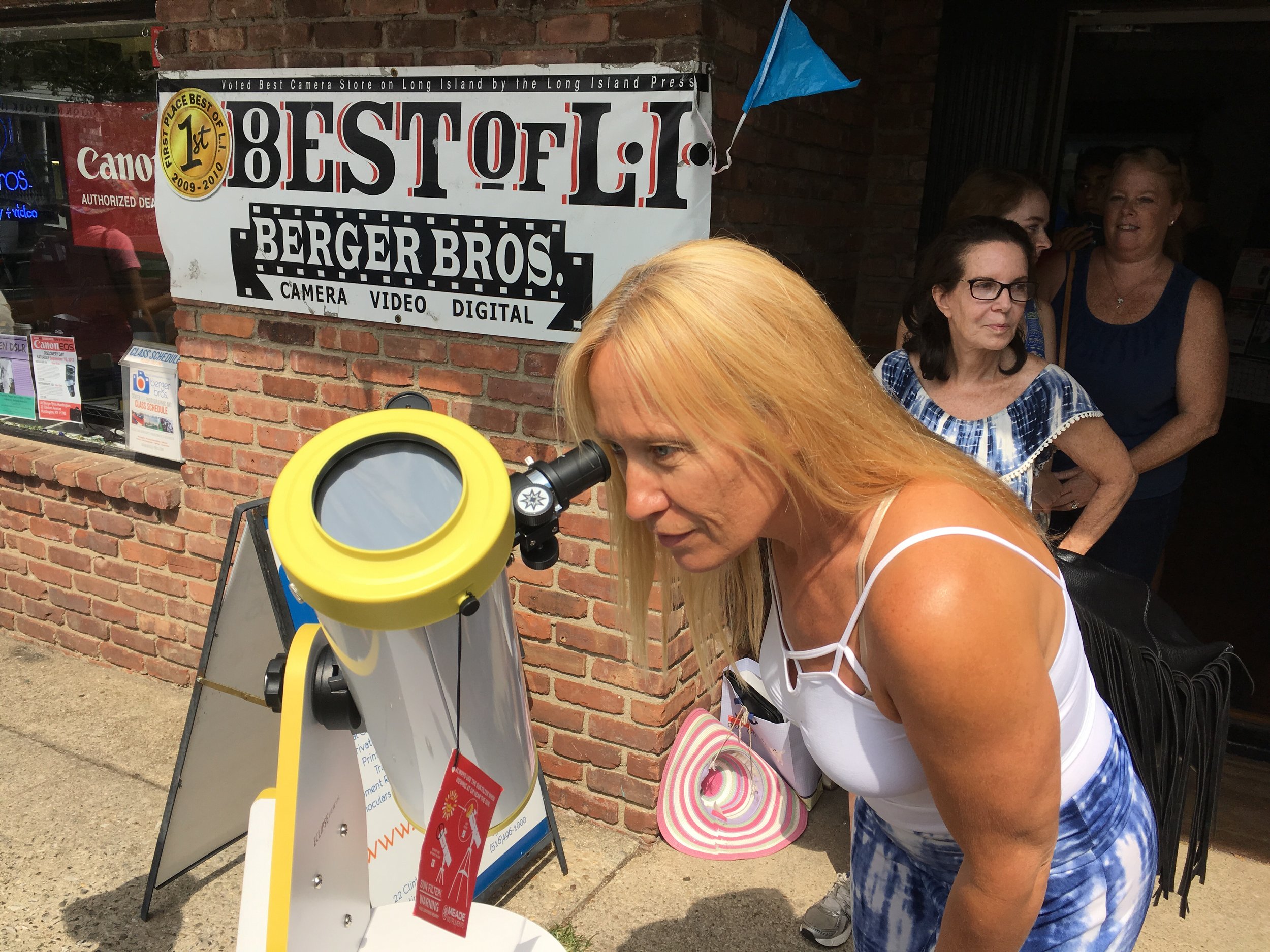  Joanne Hutchins, of Bayville, took time out of her day to see the eclipse through a telescope.&nbsp; Long Islander News photo/Paul Shapiro  