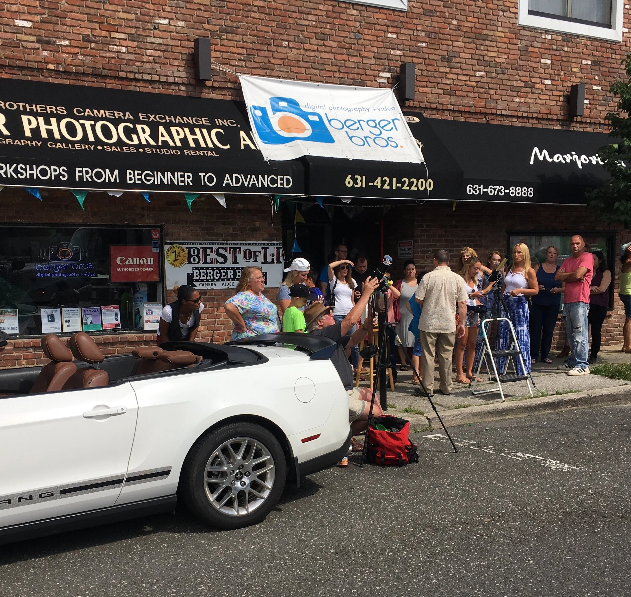 Locals Gather in Huntington Village to Watch Solar Eclipse