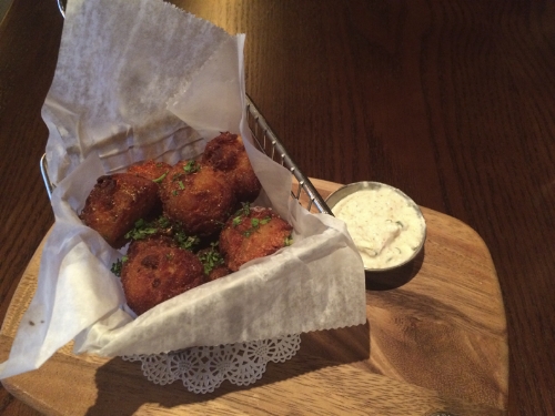   Foie Tots ($11), made of potato mixed with foie gras and served with a side of homemade horseradish sauce, are crunchy on the outside and creamy on the inside.   Long-Islander News photo/Connor Beach  