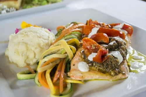   The Salmon Athena ($36) consists of fresh Scottish salmon, pistachio, potato and cauliflower puree, veggies, roasted tomatoes and tzatziki sauce.   Long Islander News photo/Barbara Fiore  