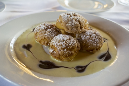   Oheka Bar &amp; Restuarant’s Swedish Profiteroles ($12) consist of Bavarian cream and crème anglaise, and make for a tasty after-dinner treat.   Long Islander News photo/Barbara Fiore  