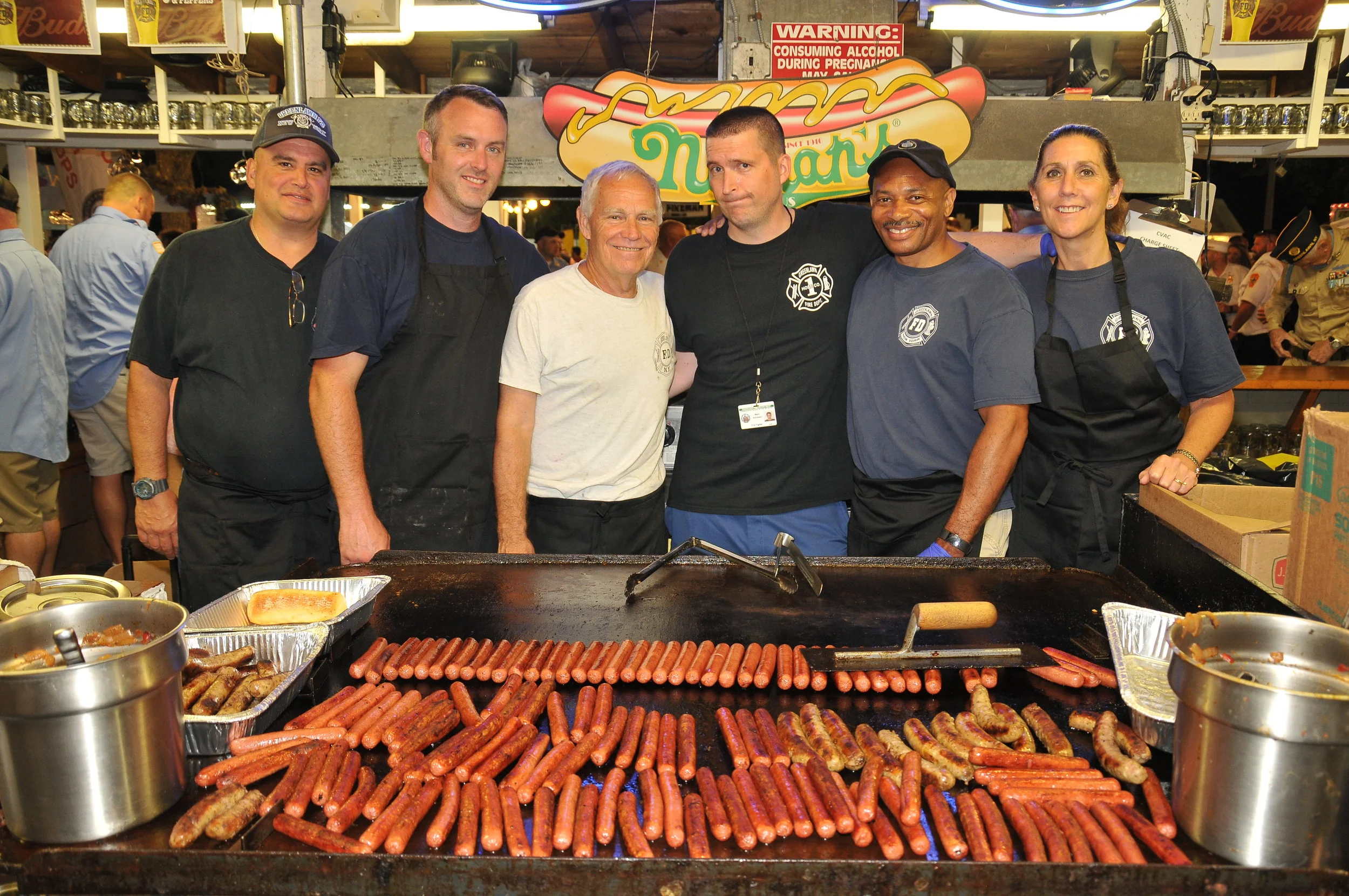   There was plenty of food at the fair, including these hot dogs and sausages cooked up by Greenlawn firefighters.   Photo Courtesy of Steve Silverman  