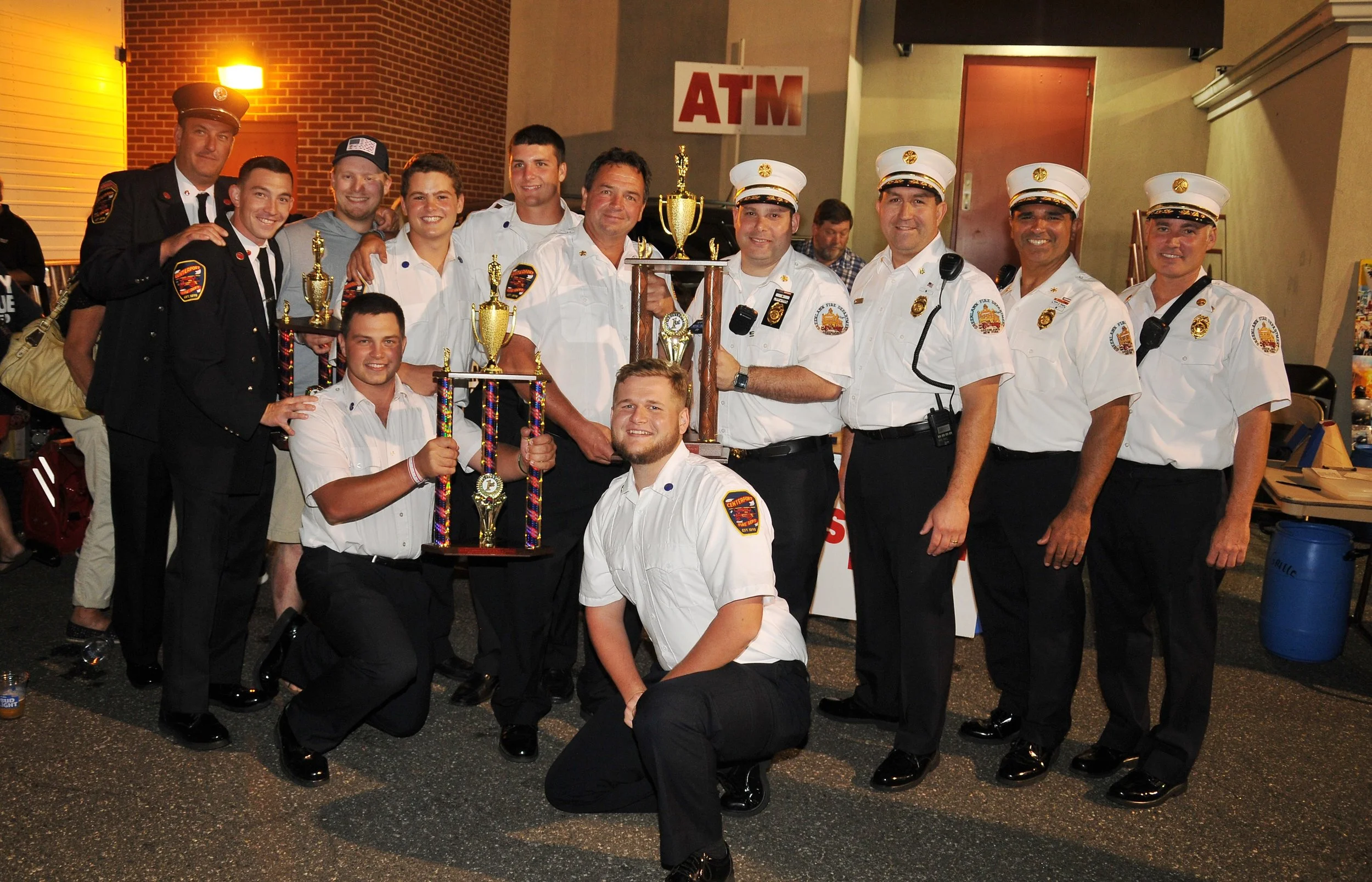   Centerport Fire Chief Tom Boyd and firefighters receive trophies from Greenlawn Fire Chief Mike Bellis and his assistant chiefs for Centerport’s participation in this year’s parade.   Photo Courtesy of Steve Silverman  