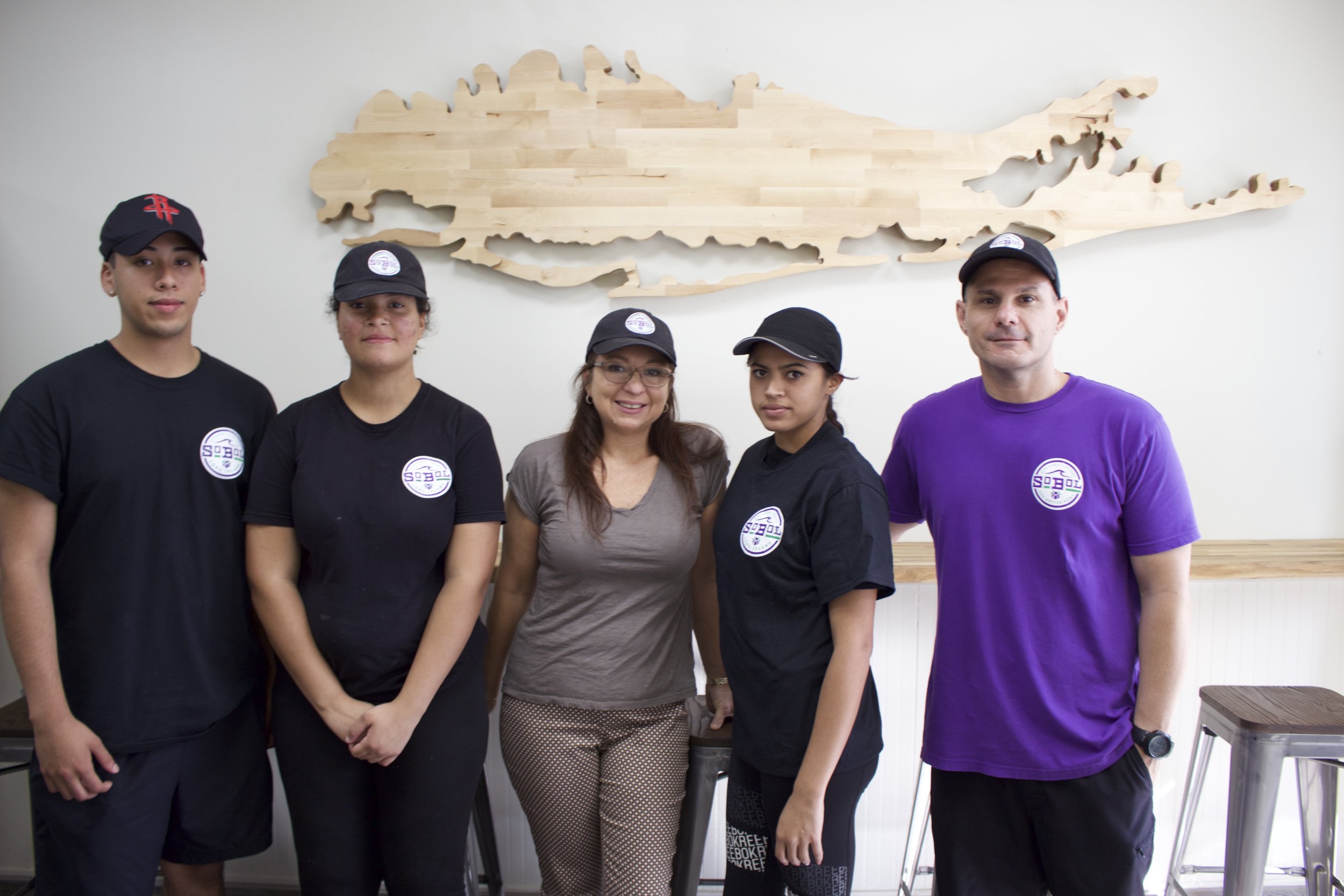   Sandra Recchione, owner of SoBol in Huntington, said the franchise is like a big family. Pictured, from left, are: Marvin Hidalgo, team member; Tessa Duff, aspiring assistant manager; Recchione; Andrea Ortiz, food prep worker; and Pat Herrera, area