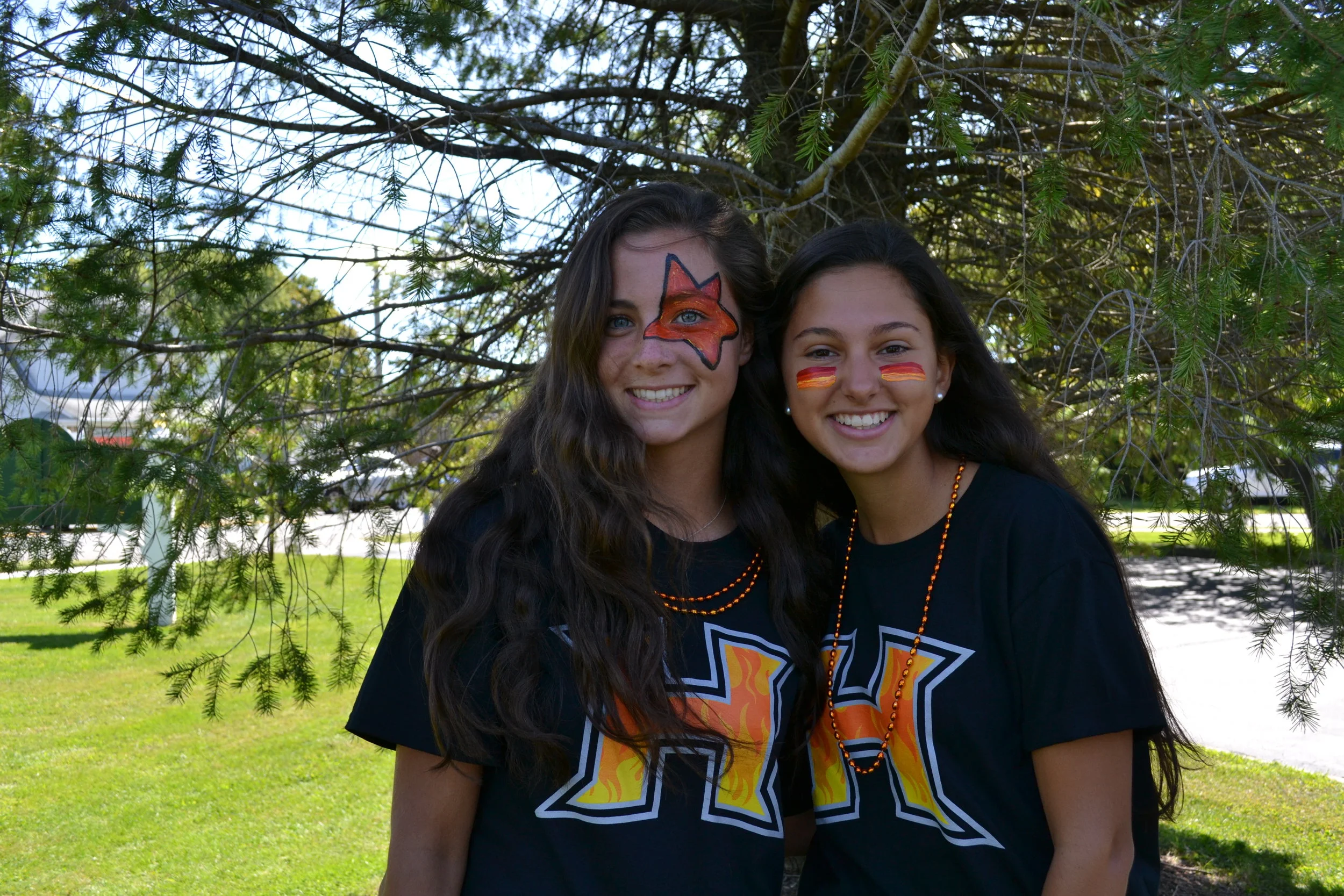   Seniors Carley Malico and Julianna Cavallaro rock out during the parade.&nbsp;  Photos/Harborfields Central School District  