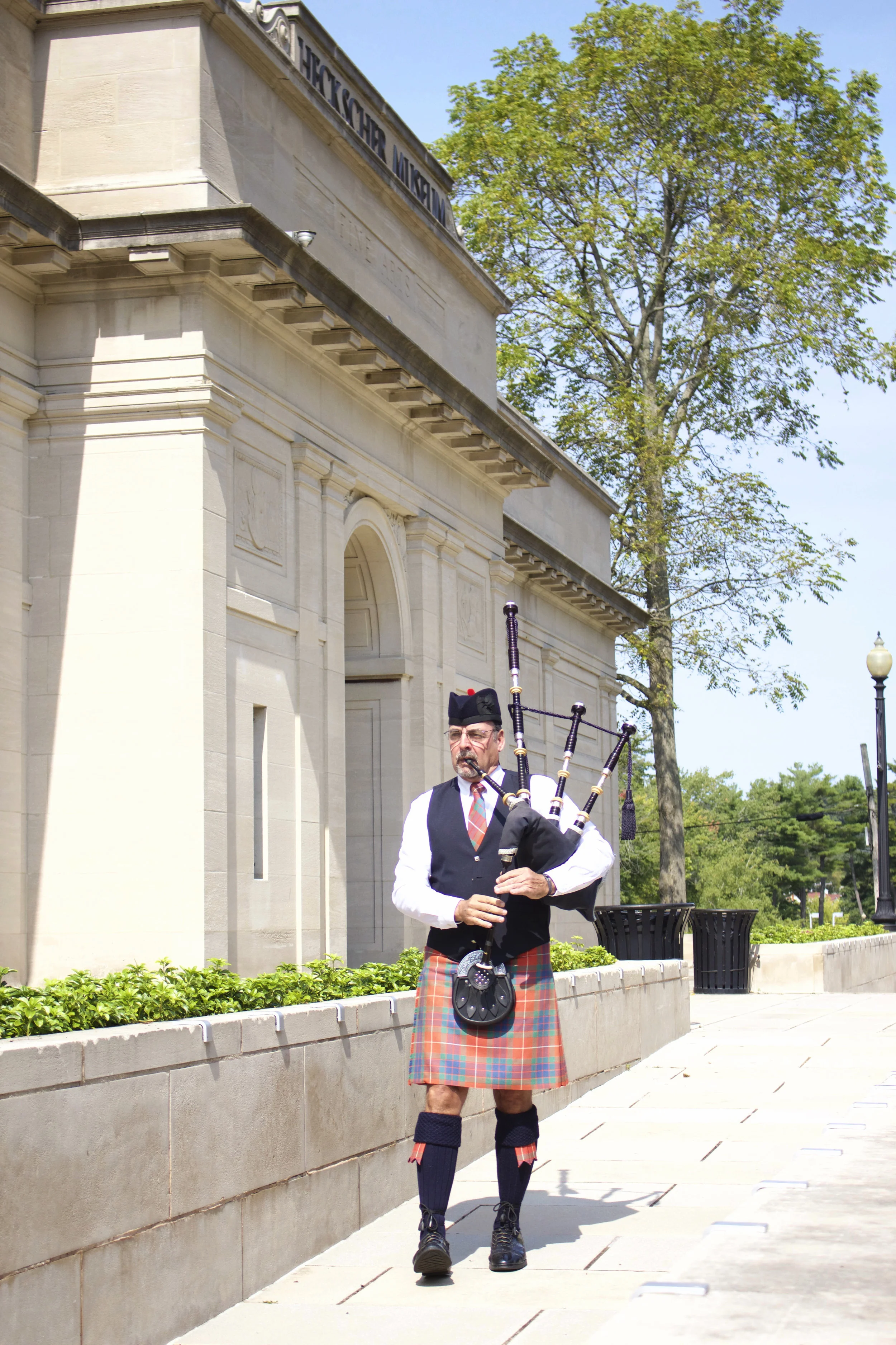   Patrick McBride plays the bagpipes during the annual 9/11 Memorial ceremony held in Heckscher Park on Monday.   Long Islander News photos/Janee Law  