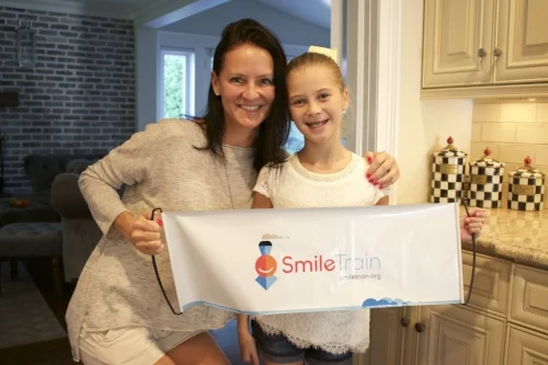 Kelli and Ella Pastorelli, along with the rest of the Pastorelli clan, have raised nearly $250,000 for Smile Train to help fund corrective surgeries for children with cleft lips and palates . Long Islander News photos/Janee Law
