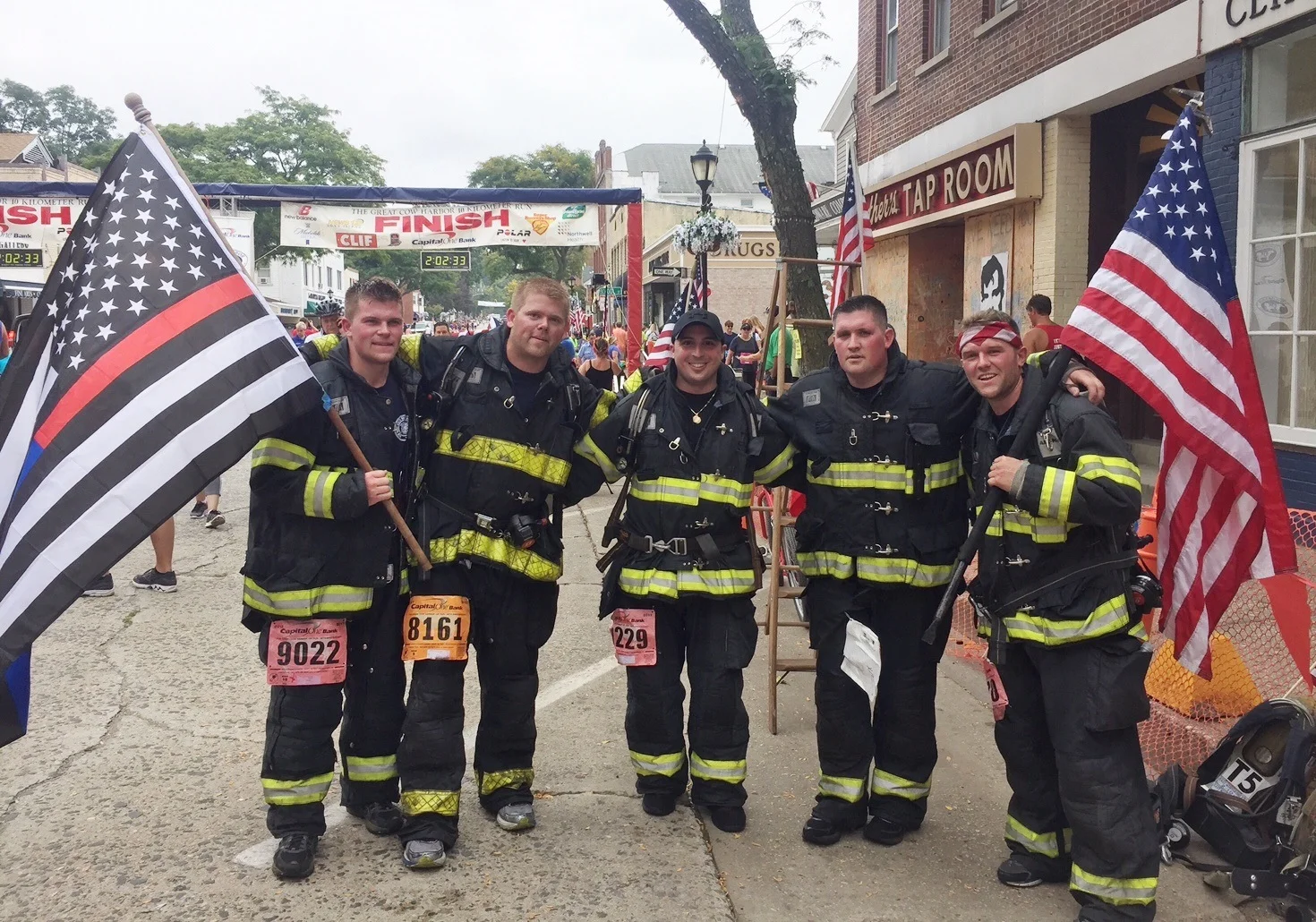   Five local firefighters, from left, Mike Gunther, Dan Cross, Lieutenant Vinny Pastore, Jamie Conroy, and Mike Ripple completed the race wearing 50 pounds of structural firefighting gear and a self-contained breathing apparatus.   Photo/East Northpo