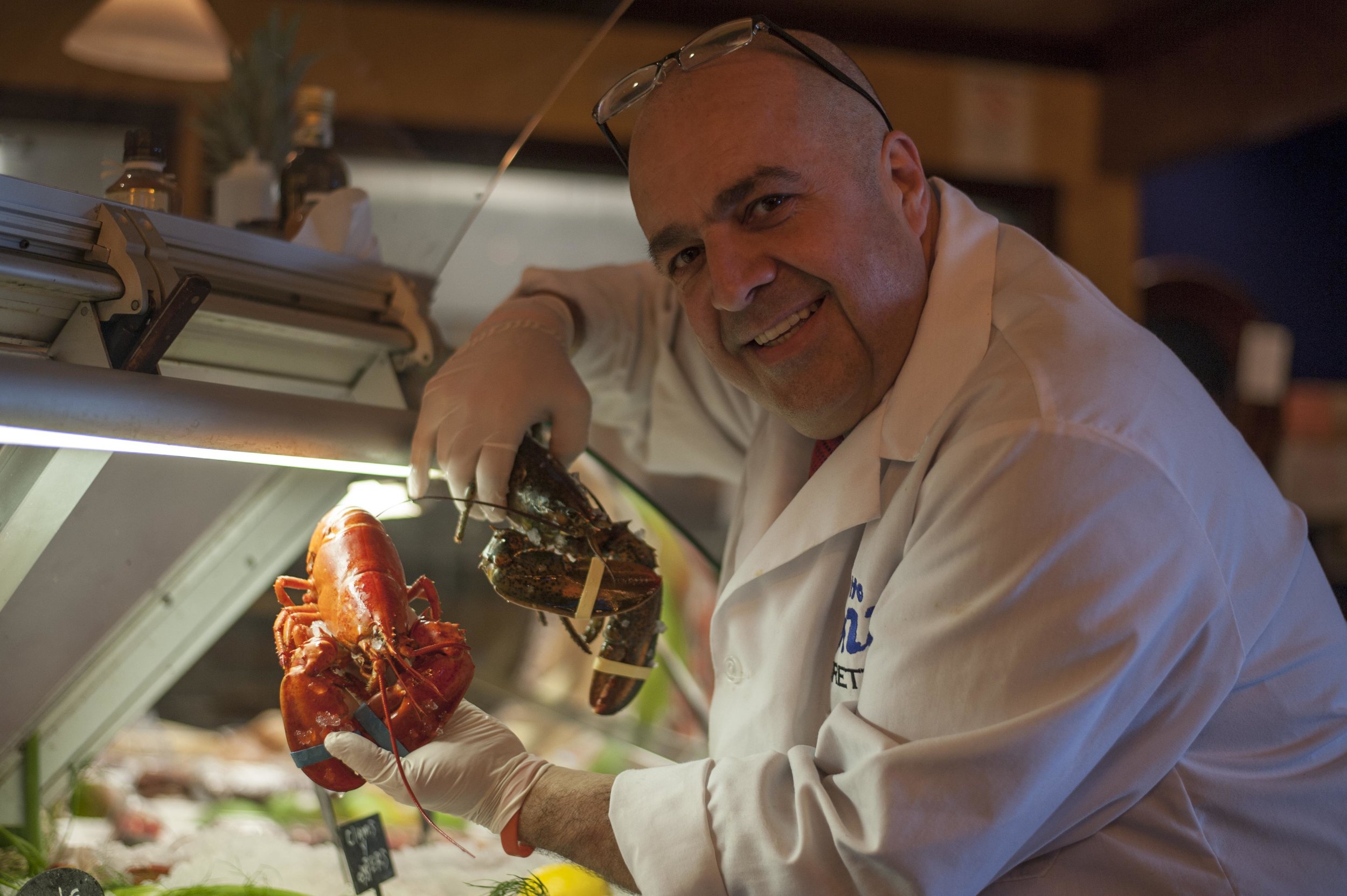   Luigi Petrone, co-owner of Tutto Pazzo, shows off some fresh lobster.   Long Islander News Photo/File  