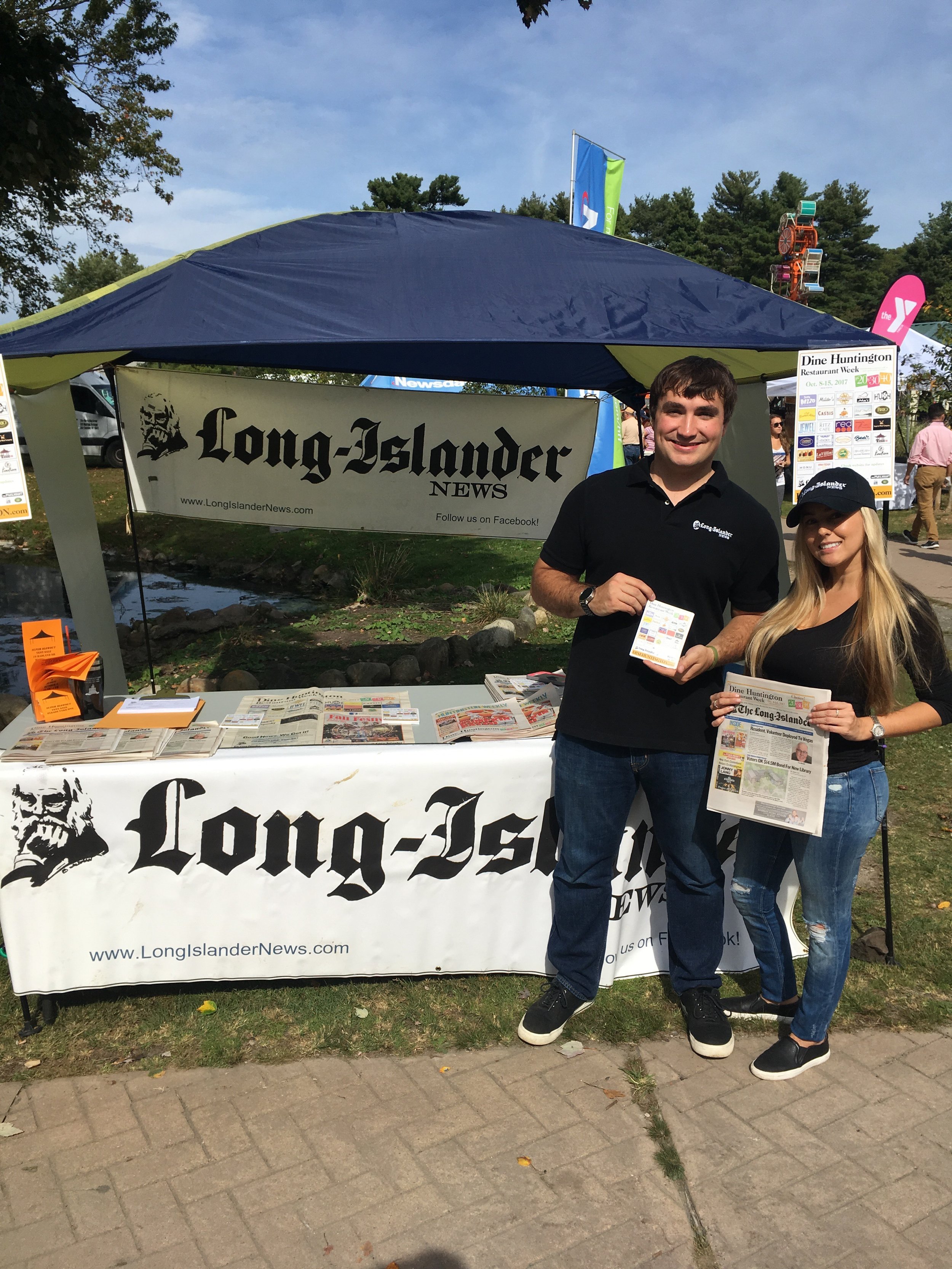   The Long-Islander team, including editor Andrew Wroblewski and volunteer Diana Murillo, handed out info on Dine Huntington Restaurant Week, running from Oct. 8-15, at the Long Island Fall Festival.&nbsp;  Long Islander News Photos/Paul Shapiro  