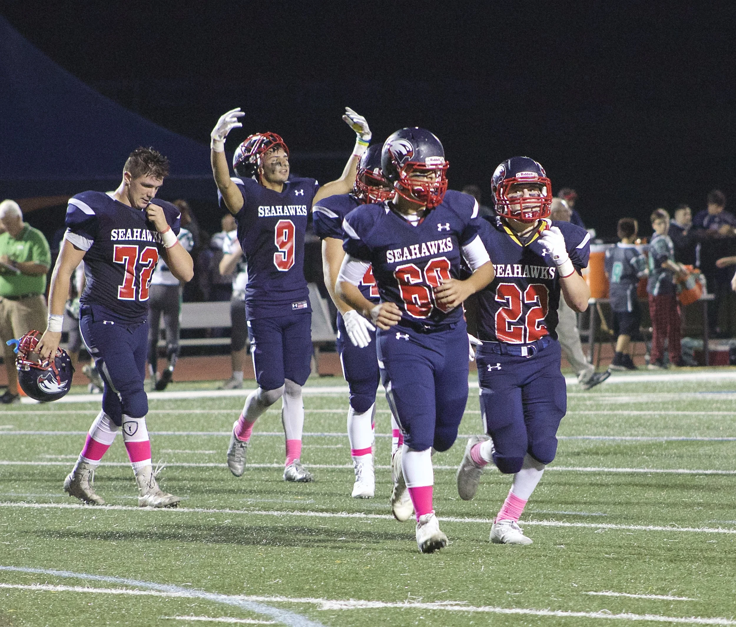   Hunter Guarneri (No. 9) motions to crowd to make noise as they come off the field at halftime.&nbsp;  Long Islander News Photo/Janee Law  