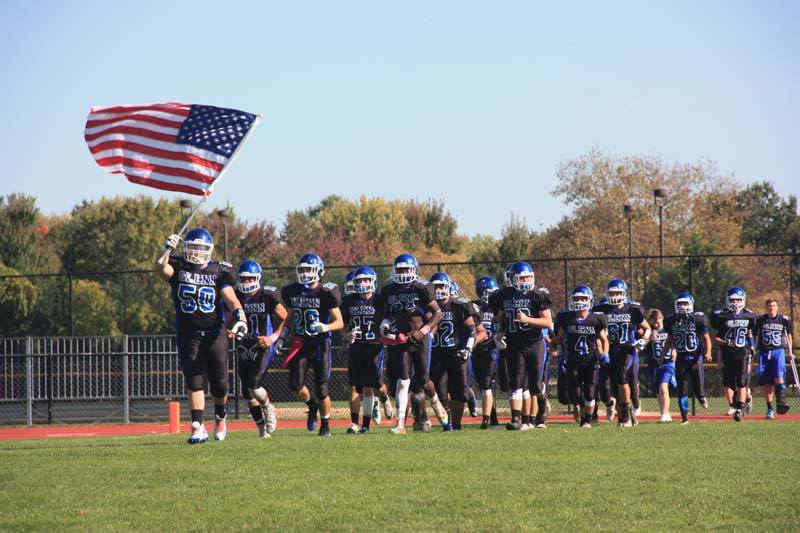   The Elwood Knights burst onto the field at their homecoming football game against Amityville. &nbsp; Photo Courtesy of Elwood Union Free School District  
