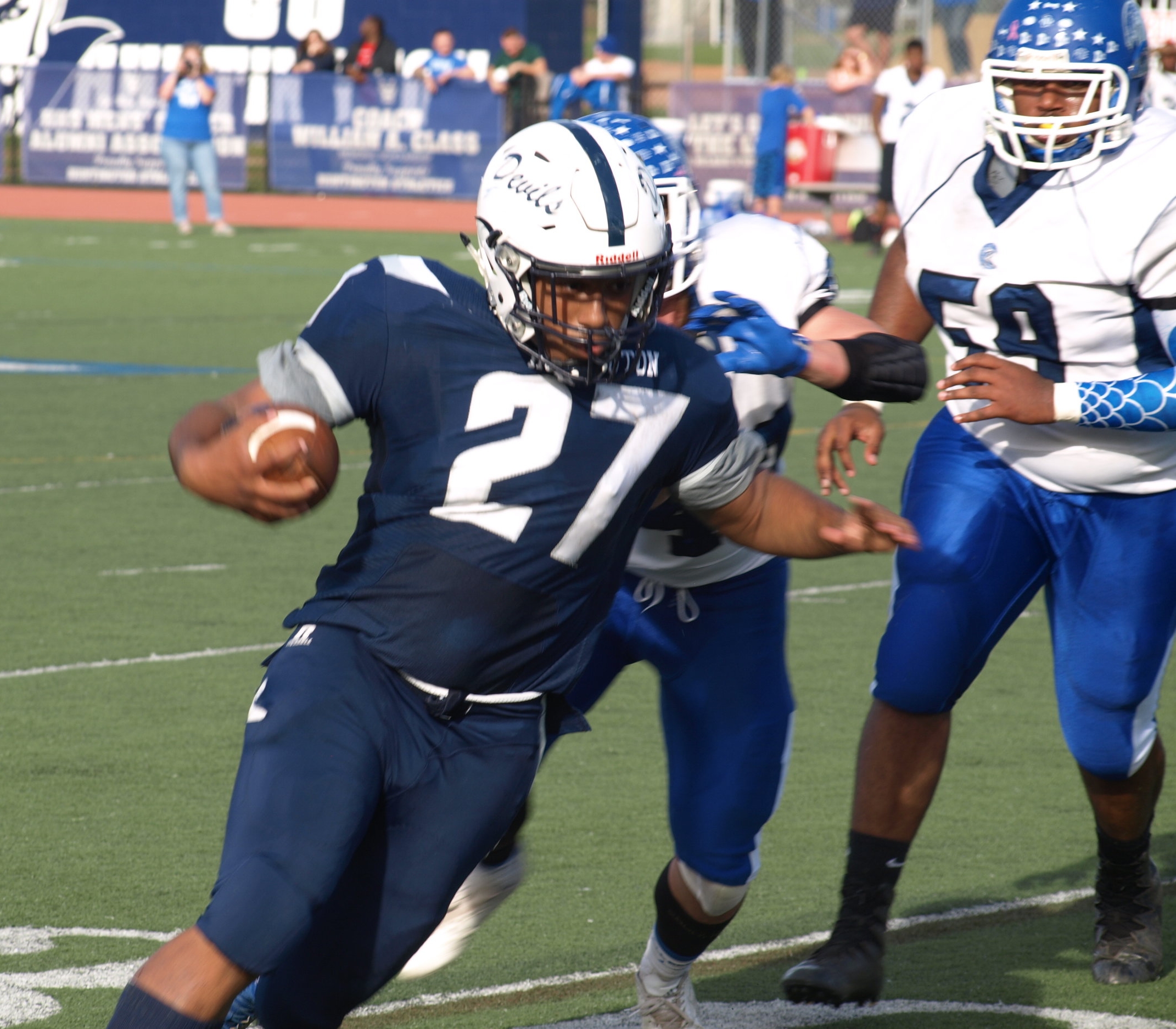   Senior running back Eric Sands breaks a tackle during his two touchdown performance on Saturday.   Long Islander News Photo/Connor Beach  