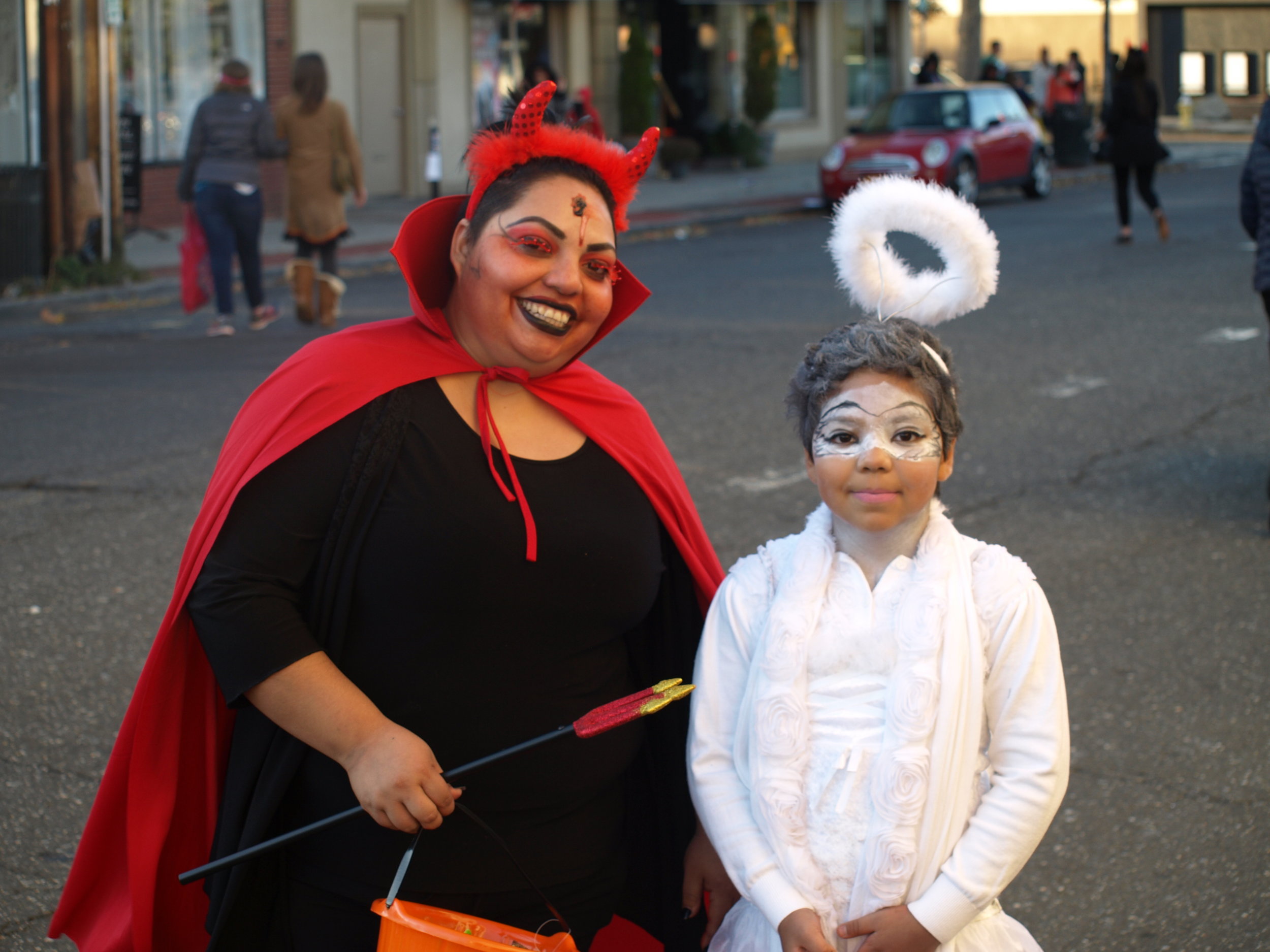   Devils and angels got to share in the Halloween spirit when merchants on Wall Street opened their doors to trick-or-treaters on Halloween. &nbsp; Long Islander News Photo/Connor Beach  