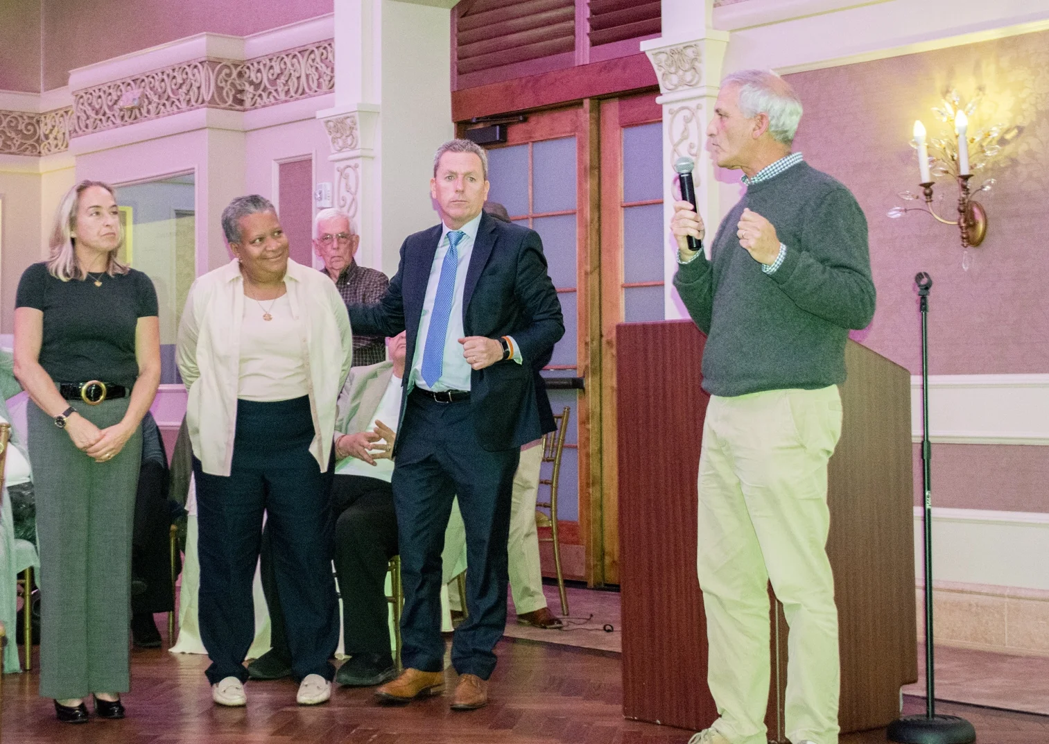 Huntington Highway Superintendent elect Kevin Orelli, right, addresses the crowd at the Democrats’ results party at The Larkfield in East Northport. He is flanked, from left, by town council candidate Emily Rogan and supervisor candidate Tracey Edwards, who were both defeated, and Councilman Mark Cuthbertson, who won reelection to his post. Long Islander News Photo/Peter Sloggatt