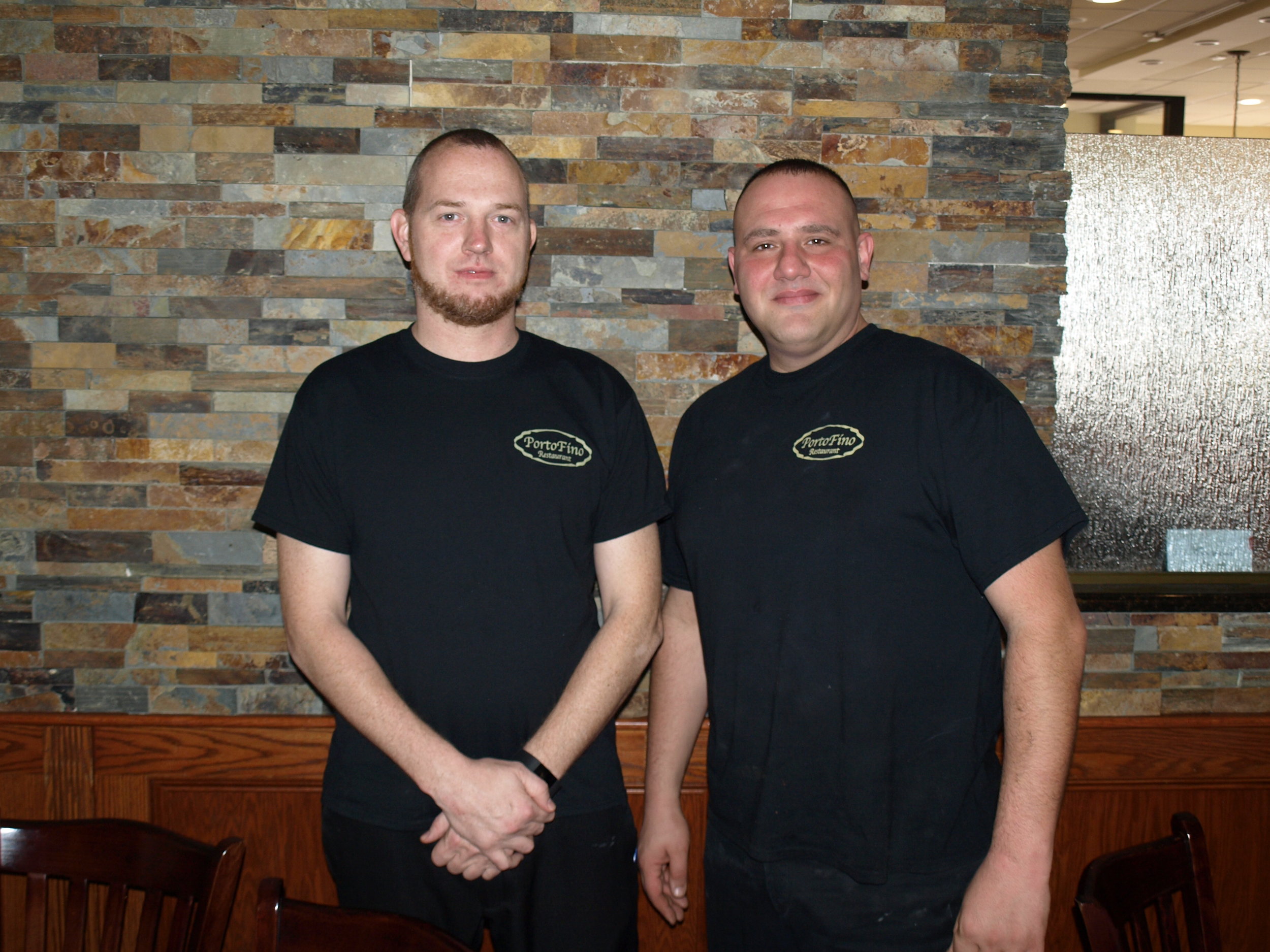   Porto Fino owner Gianni Vigliotti, right, and his first employee Tim Grill have been serving up Italian favorites in Huntington since 2012.   Long Islander News Photo/Connor Beach  