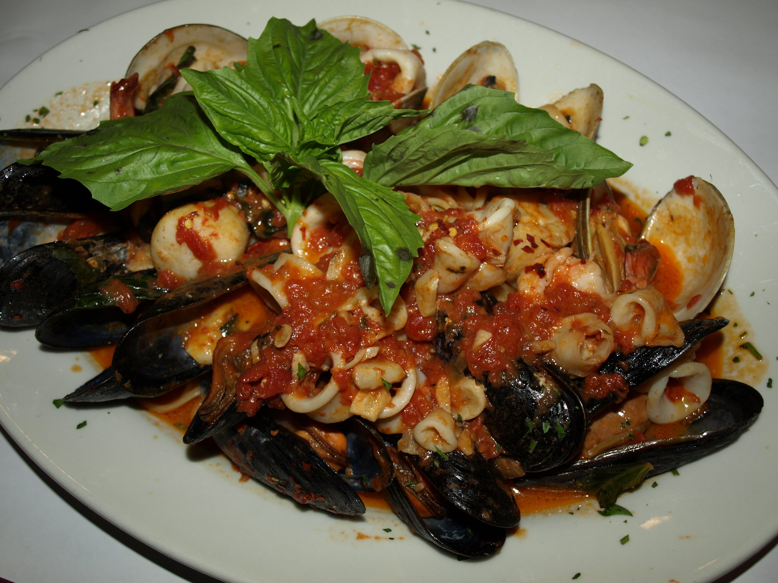   Seafood Fra Diavolo ($26.95) features a heaping platter of shrimp, mussels, clams, calamari and scallops sautéed in a spicy fra diavolo sauce on top of linguine.   Long Islander News Photo/Connor Beach  