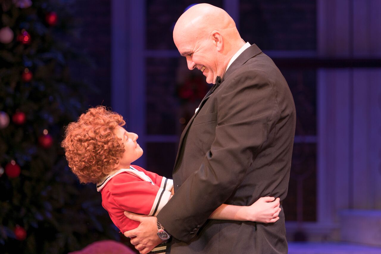   Presley Ryan (as Annie) and George Dvorsky (as Oliver "Daddy" Warbucks) melt hearts in Engeman’s production of “Annie.”   Photo by Michael DeCristofaro  