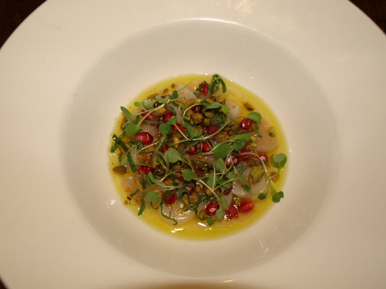   The Peconic Bay Scallop Crudo ($16) is served with pomegranate, pistachios, yuzu, white soy and mint.&nbsp;  Long Islander News Photo/Connor Beach  