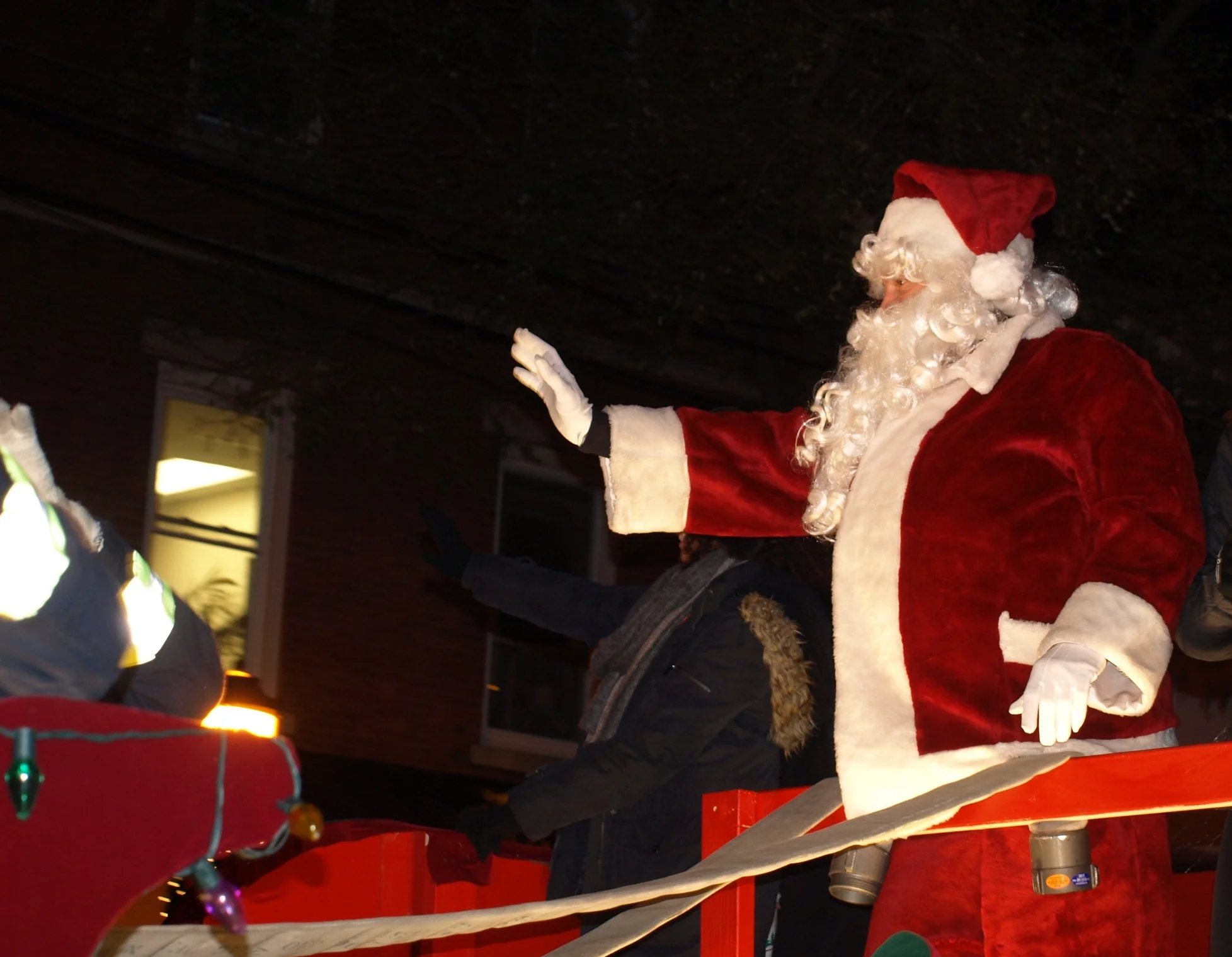   Santa Claus comes to town on the back of a Melville Fire Department truck.&nbsp;  Long Islander News Photo/Connor Beach  