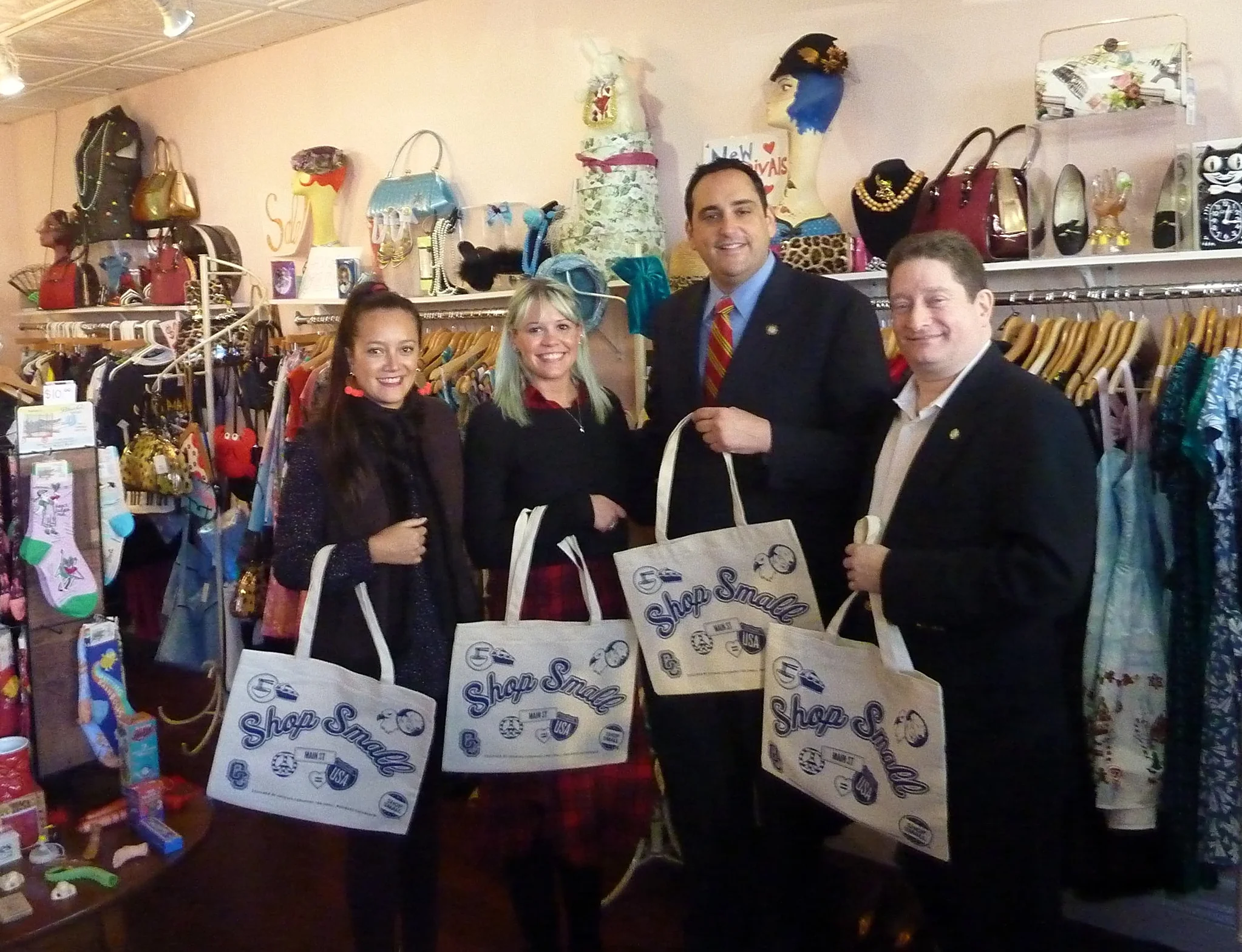   Paper Doll Vintage Boutique employee Ali French, second from left, welcomed a visit from business and government representatives on Small Business Saturday. From left are: Andrea Bonilla of Renaissance Downtowns,&nbsp;French, Huntington Supervisor-
