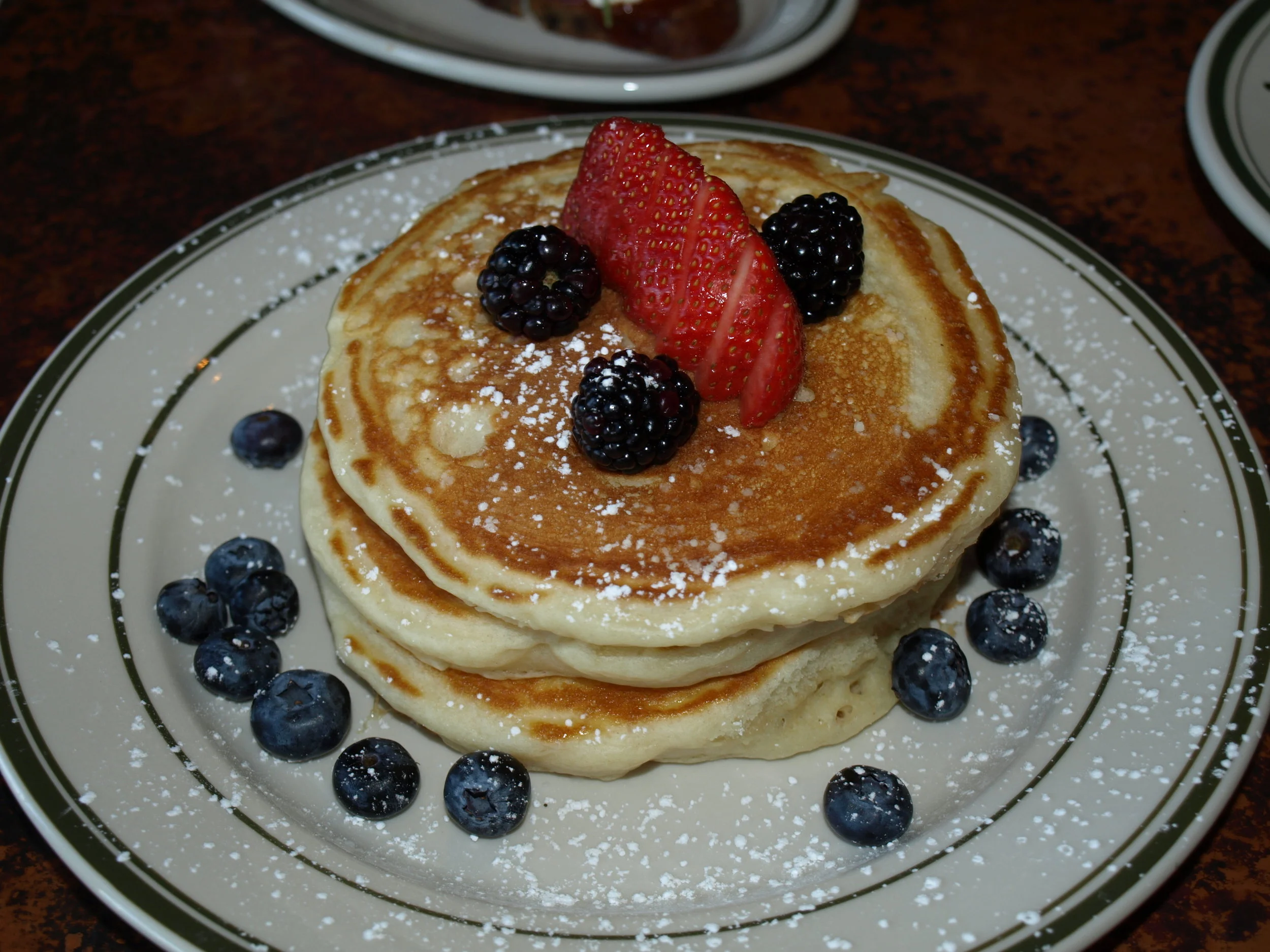    &nbsp; The Buttermilk Pancakes ($11) are served with butter, maple syrup and fresh berries.   Long Islander News photos/Connor Beach  
