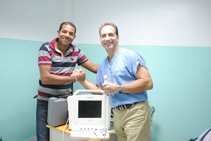 Dr. Ernest Vomero, of Centerport, donates an ultrasound machine to the village hospital in El Cercado in the Dominican Republic. Vomero is pictured with the hospital’s medical director. Photo courtesy of Dr. Ernest Vomero
