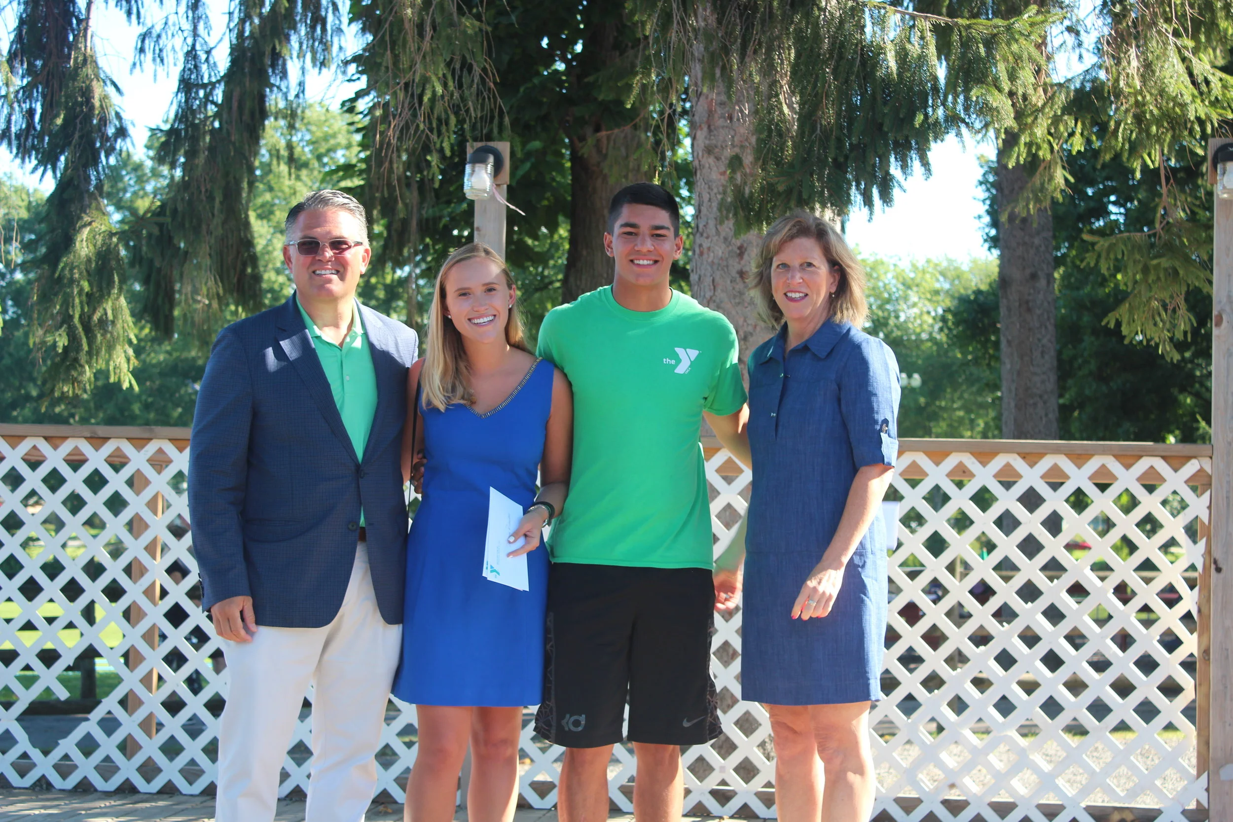   Pictured from left to right, Peter Klein, Claire Friedlander Family Foundation president, Kelly Klein, foundation board member, award recipient Josh Kaplan and Eileen Knauer (SVP, COO of YMCA of Long Island)&nbsp;  Long Islander News photo/Janee La
