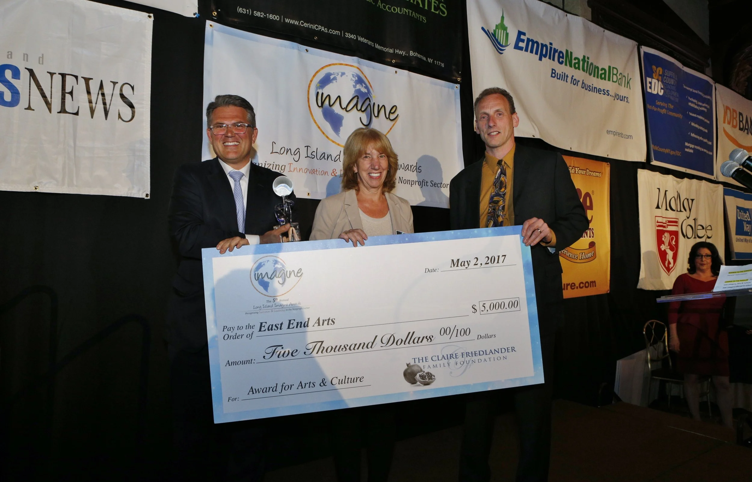   Peter Klein, president of the Claire Friedlander Family Foundation, presents the $5,000 Claire Friedlander Family Foundation Rising Star Award to Patricia Snyder, East End Arts, Imagine Awards founder Kenneth Cerini, Cerini and Associates LLP.&nbsp