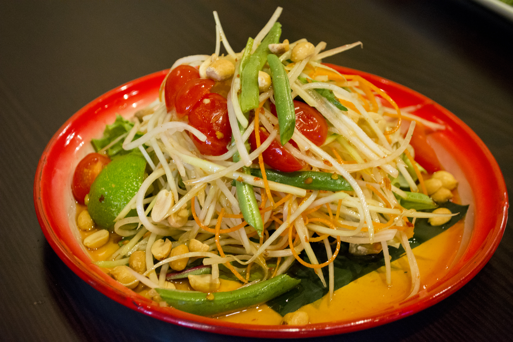 The Som Tum, or Papaya Salad, ($8) combines green papaya, tomato, green beans, peanuts, chili and pepper in a lime sauce. Long Islander News photos/Connor Beach
