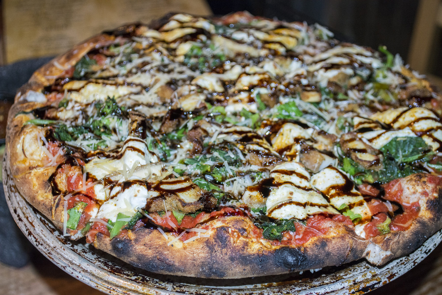   The Mamma Mia Pizza ($13.95) from The Refuge’s pizza oven is topped with chicken cutlet, broccoli rabe, tomato, mozzarella, Parmesan and a balsamic drizzle.   Long Islander News photos/Barbara Fiore  