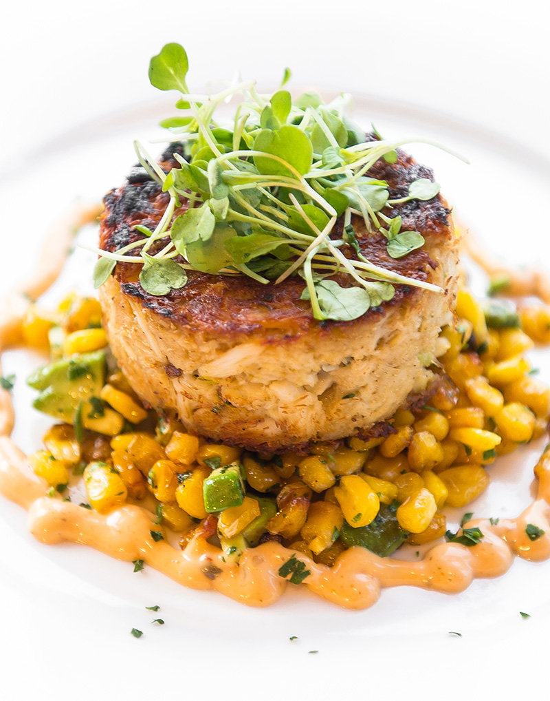 Choices for the first course on Mill Pond’s Valentine’s Day menu include a Maryland Jumbo Lump Crab Cake with avocado, roasted corn and remoulade. Photo Courtesy Abbie Lipton