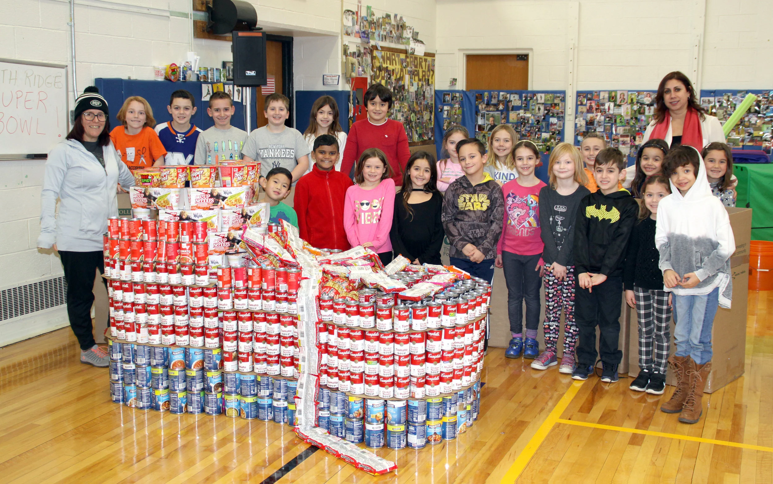 Students of North Ridge Primary School in Commack collected a whopping 7,188 cans and bags of soup last month, ahead of last Sunday’s big game, to donate to Long Island Cares. Photo/Commack School District