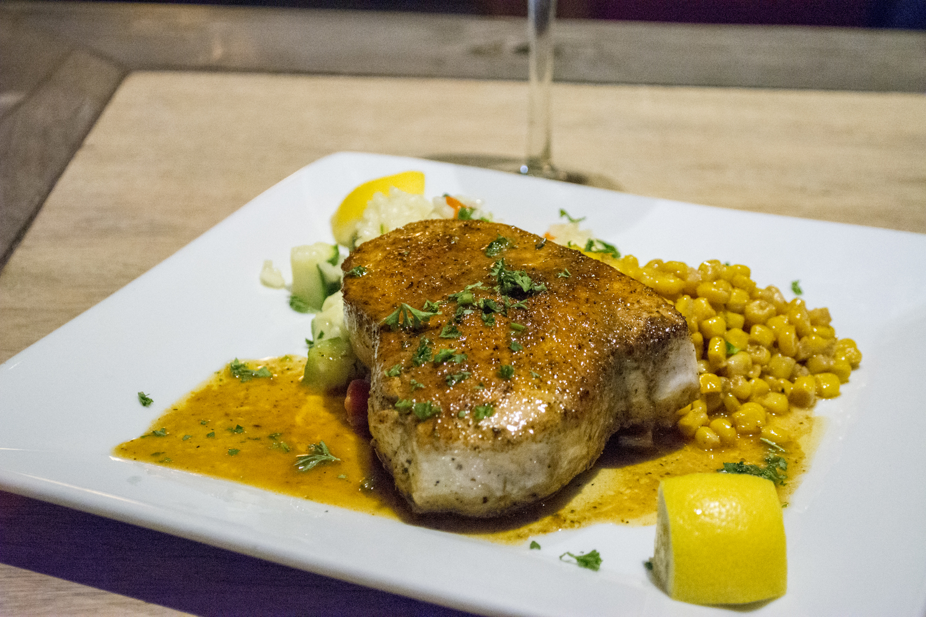 The Blackened Swordfish ($32) is served over vegetable risotto and Caribbean corn. Long Islander News photos/Barbara Fiore