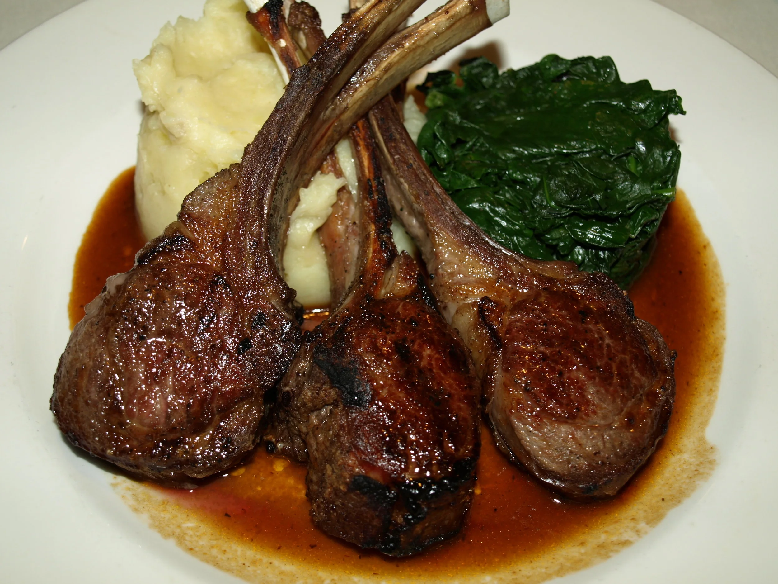   The Lamb Chops ($39) feature domestic Colorado lamb chops that are grilled to order with a rosemary and garlic jus, mashed potatoes and sautéed spinach.   Long Islander News photos/Connor Beach     