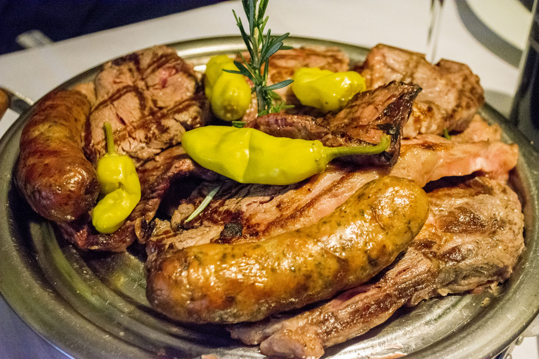   The Parrillada Del Sur for Two ($64) is a mixed grill platter that features medallions of filet mignon, rack of lamb, skirt steak and Argentinian sausage served with salsa criolla and chimichurri sauce.   Long Islander News photos/Connor Beach  