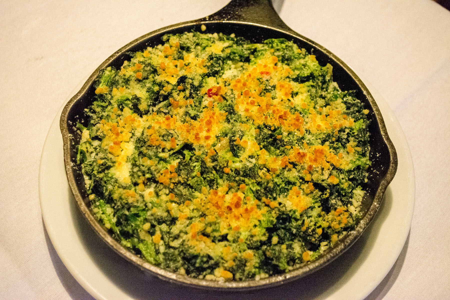 The Creamed Spinach ($5) is baked and topped with Parmesan cheese. Long Islander News photos/Connor Beach