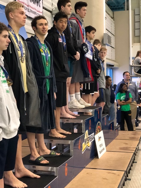   Standing in fourth place for the 100-yard backstroke is Half Hollow Hills’ Dylan Chan.  