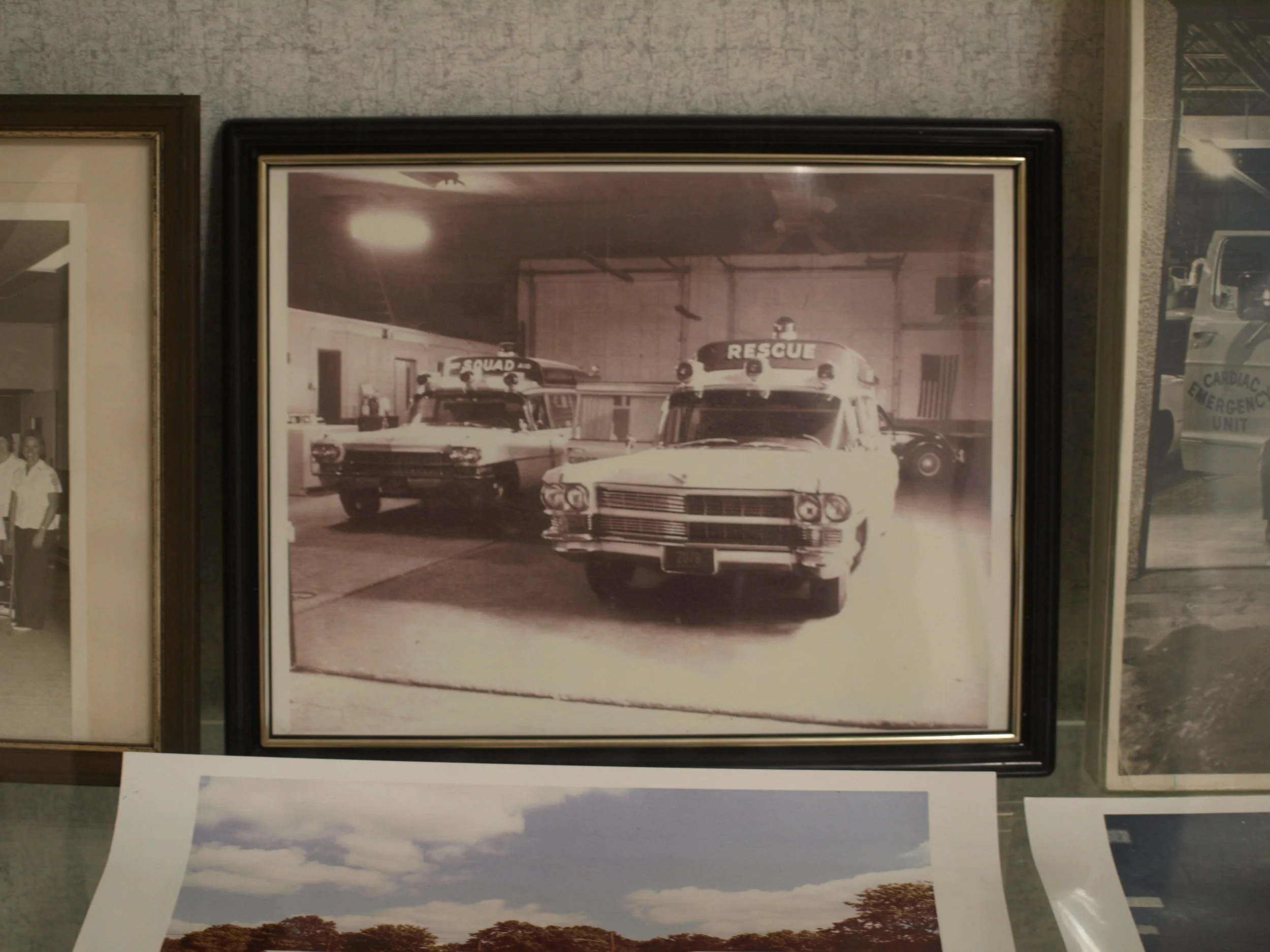   A photograph on display in the lobby of the HCFAS headquarters shows the original ambulances inside the original 1967 building.   Long Islander News photos/Connor Beach &nbsp;  