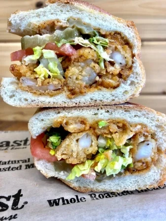 The new popcorn shrimp po’boy at Roast in Melville. Photo/Facebook/Roast
